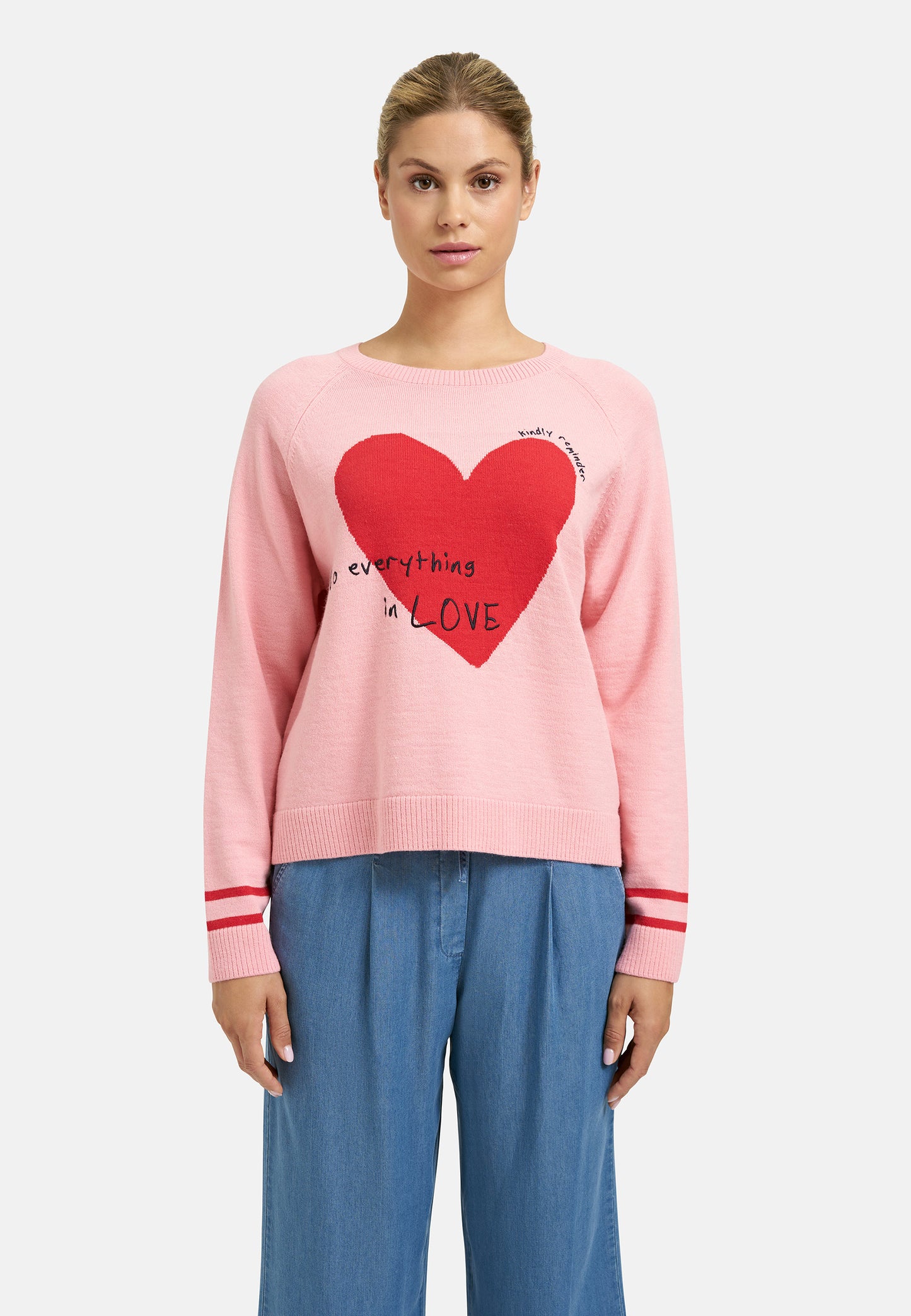 Pink sweater with red heart and text 'Do everything in LOVE'