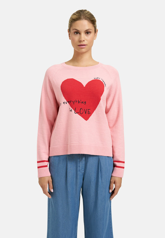 Pink sweater with red heart and text 'Do everything in LOVE'