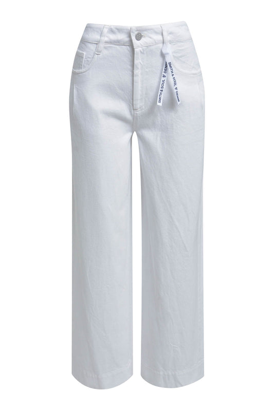 White high-waisted heans with a slightly wide leg and flower detail on back pocket.