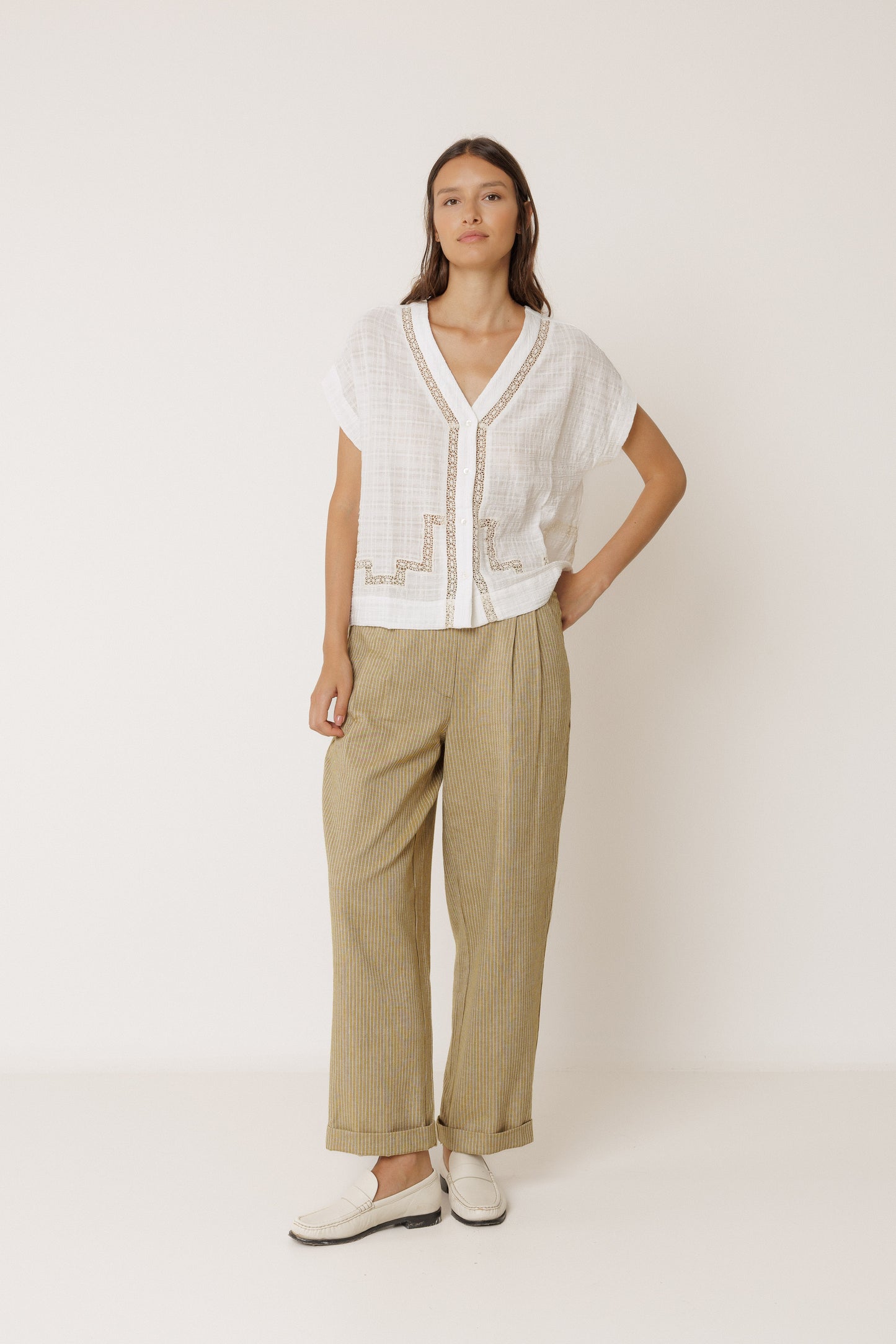 White v-neck relaxed short-sleeve cotton blouse with beige lace detail