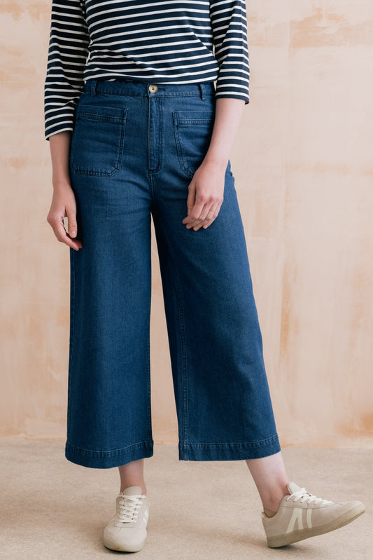 Women's cropped dark wash denim trousers with front pocket detail and wide leg