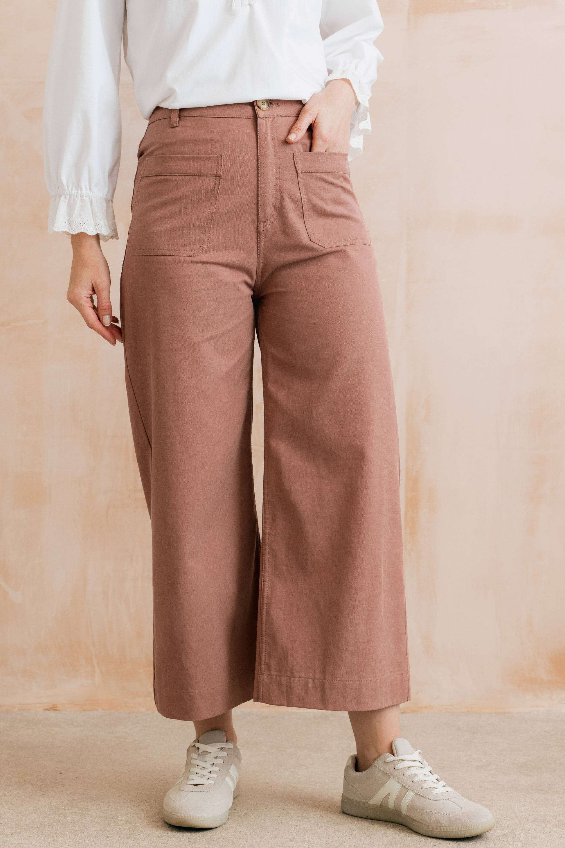 high-waisted, cropped dusty pink trousers with pockets